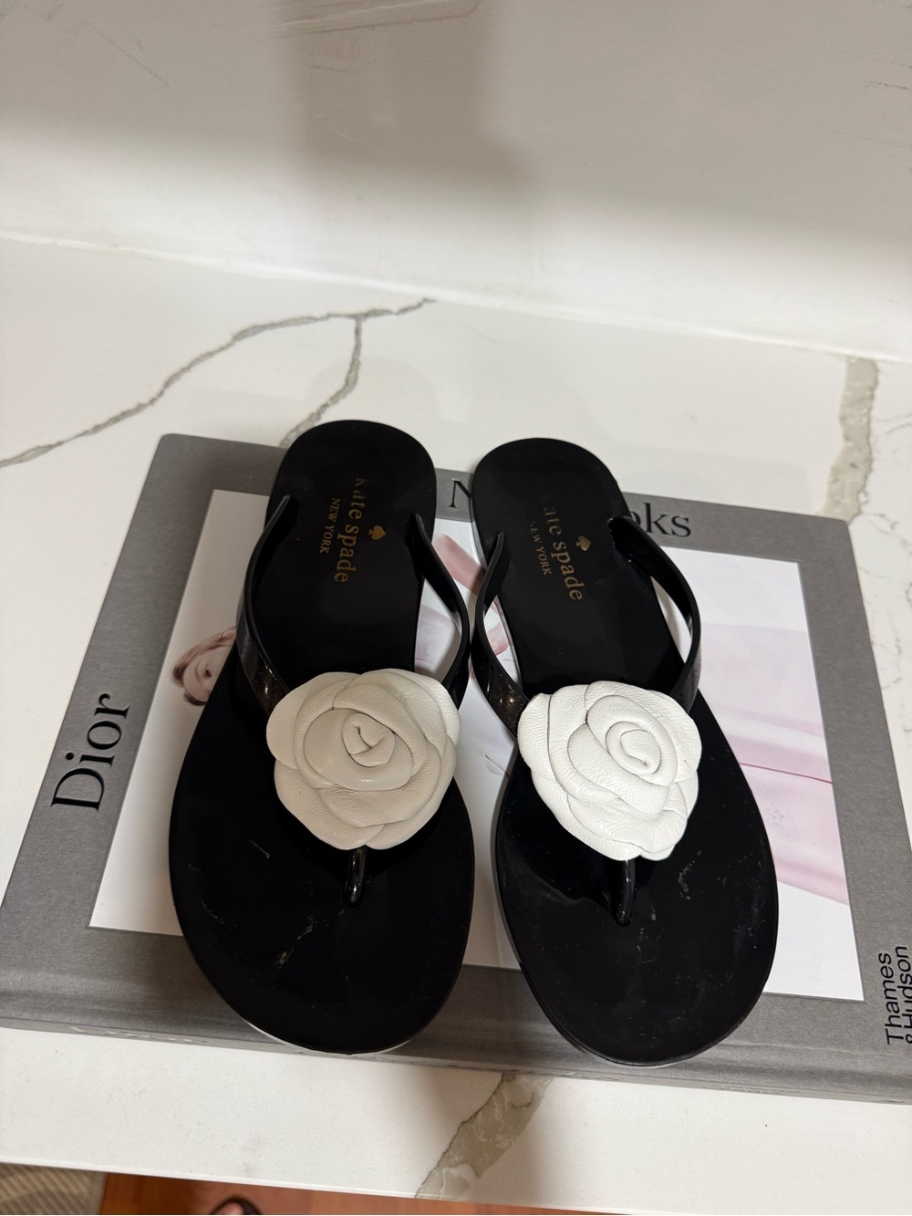 kate spade Black Sandal Flip-Flops with White Floral Appliqué